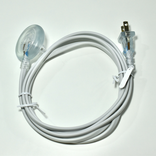 Smaller copy of a photograph of the iBook-era power adapter cord by Matthew J. Fuller, quoted from an 18 april 2020 post in his site's Apple Collection section.